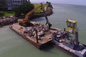 Bolstering existing rock revetment, Redfish Pass, Captiva Island.